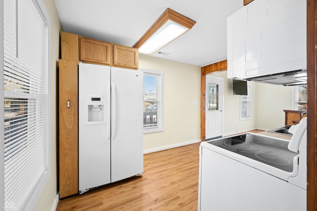 100 N Jefferson St, Nashville, IN 47448 - kitchen featuring white appliances and light wood-type flooring