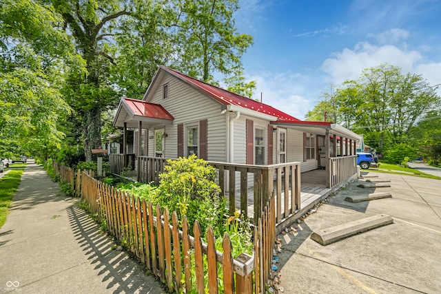 100 N Jefferson St, Nashville, IN 47448 - view of home's exterior featuring a metal roof and a porch