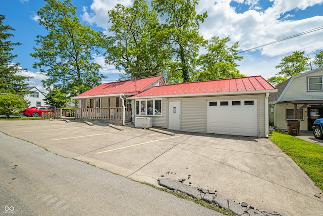 100 N Jefferson St, Nashville, IN 47448 - view of front of home with a metal roof and uncovered parking