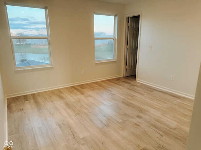 unfurnished room featuring light hardwood / wood-style flooring