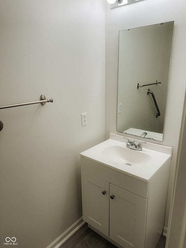 bathroom featuring vanity and hardwood / wood-style flooring