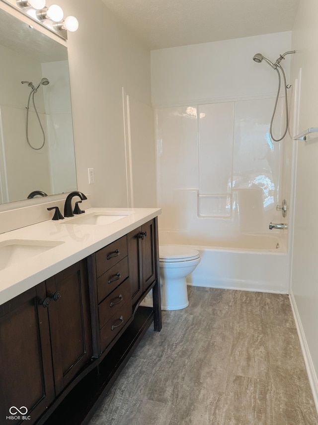 full bathroom featuring vanity, tub / shower combination, and toilet