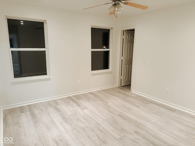 spare room with light hardwood / wood-style flooring and ceiling fan