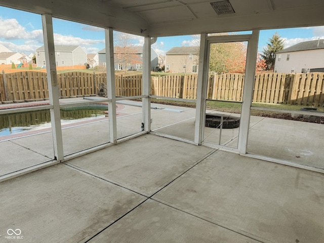 unfurnished sunroom featuring a healthy amount of sunlight