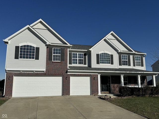 view of front of house featuring a garage and a porch