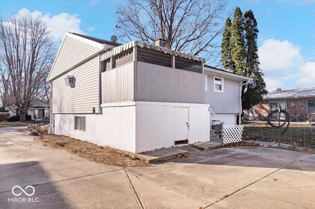 view of property exterior featuring a garage