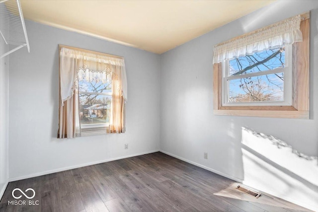 unfurnished dining area with dark hardwood / wood-style flooring