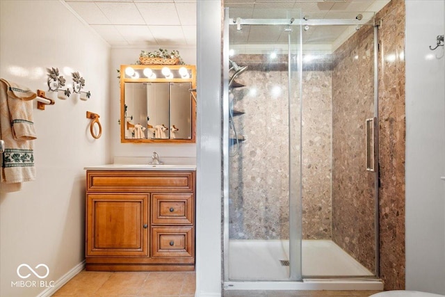 bathroom with tile patterned floors, vanity, and a shower with shower door