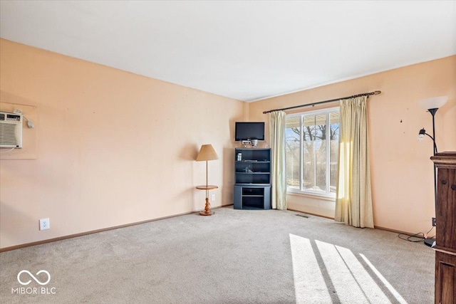 unfurnished living room featuring carpet flooring