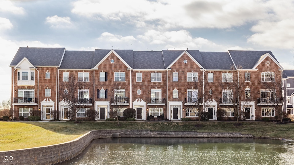 view of property with a water view