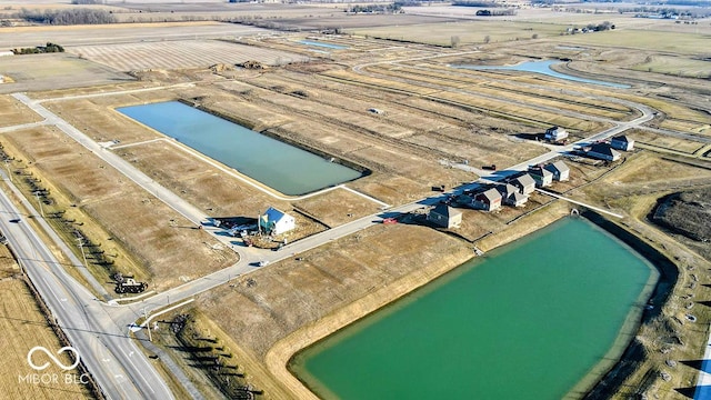 bird's eye view featuring a rural view and a water view