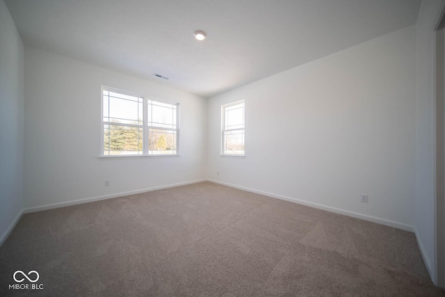 unfurnished room with carpet flooring