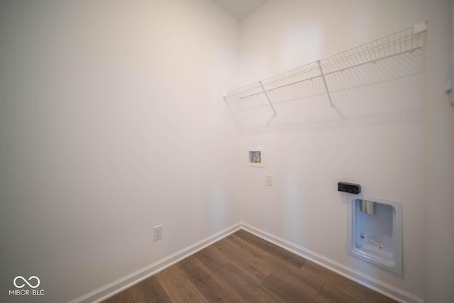 laundry area with dark hardwood / wood-style flooring and hookup for a washing machine