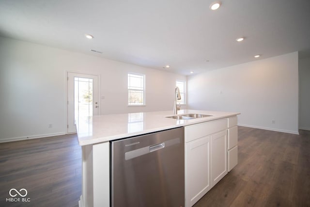 kitchen featuring white cabinets, dark wood-type flooring, sink, a kitchen island with sink, and stainless steel dishwasher