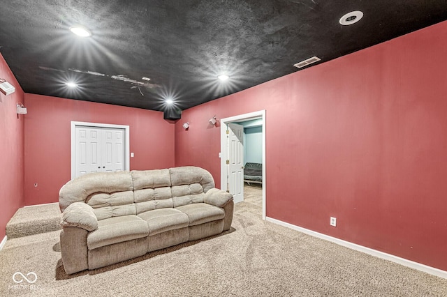 living room with carpet floors, recessed lighting, visible vents, and baseboards