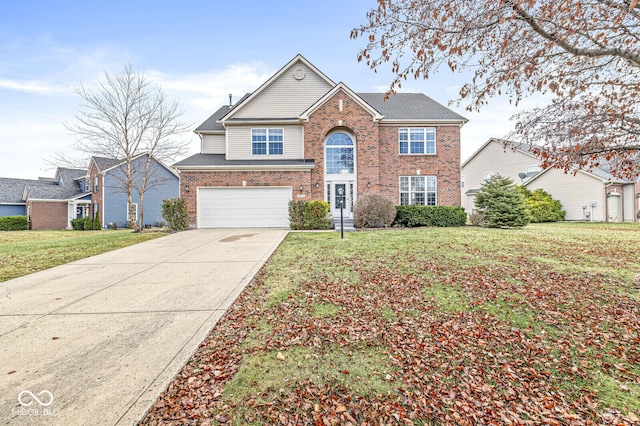 traditional-style house with an attached garage, a front yard, concrete driveway, and brick siding