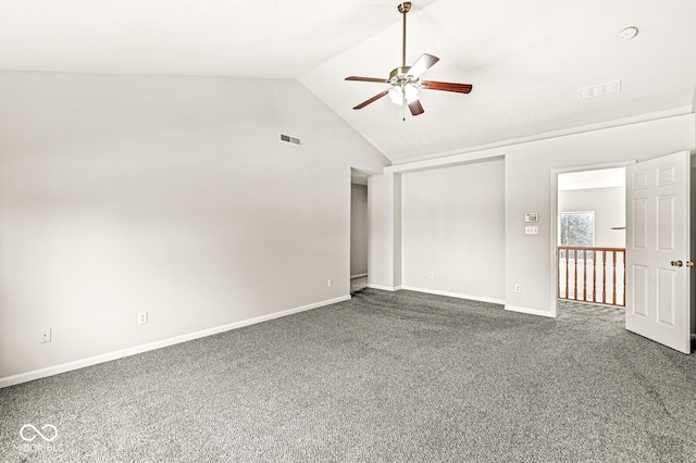 empty room featuring carpet floors, lofted ceiling, visible vents, and ceiling fan