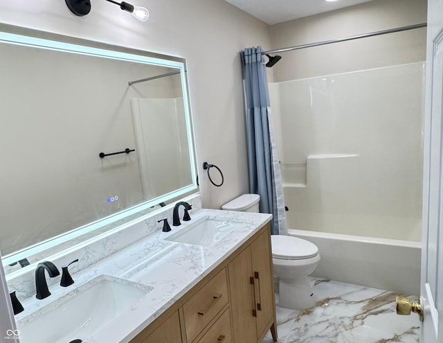 full bathroom with double vanity, shower / bath combo, a sink, and toilet