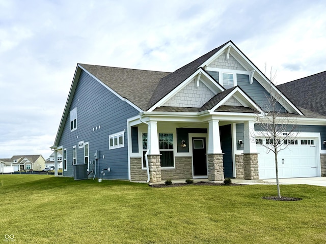 craftsman inspired home with central air condition unit, a front lawn, and covered porch