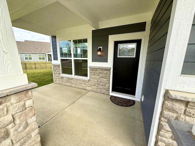 entrance to property with a porch