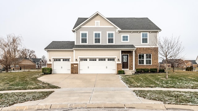 view of front of property featuring a garage and a front lawn