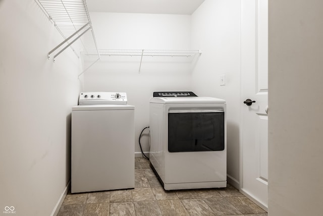 clothes washing area with washer and dryer