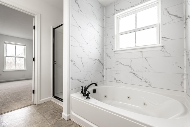 bathroom featuring independent shower and bath