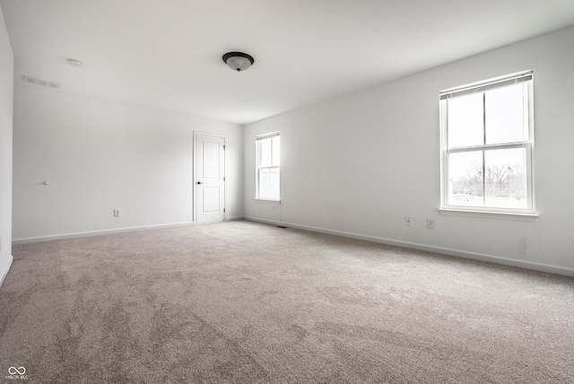 unfurnished room featuring carpet floors