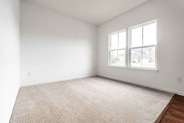 spare room with hardwood / wood-style floors