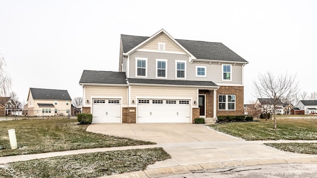 view of front of home with a garage and a front lawn