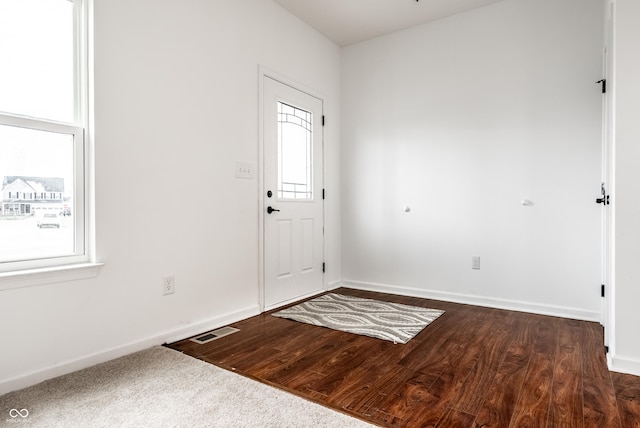 entrance foyer featuring dark hardwood / wood-style floors