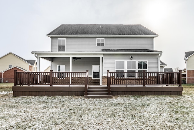 back of property featuring ceiling fan and a wooden deck