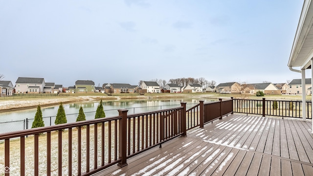 wooden deck with a water view