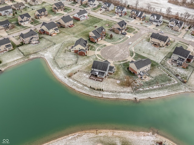 drone / aerial view with a water view and a view of the beach