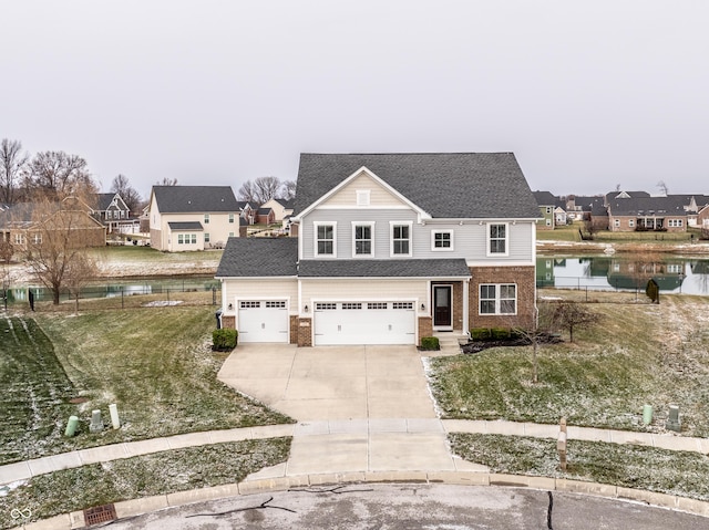 front of property with a water view, a front yard, and a garage