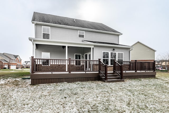 rear view of property featuring a deck