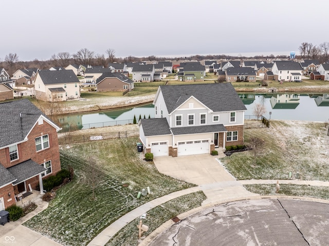 birds eye view of property featuring a water view