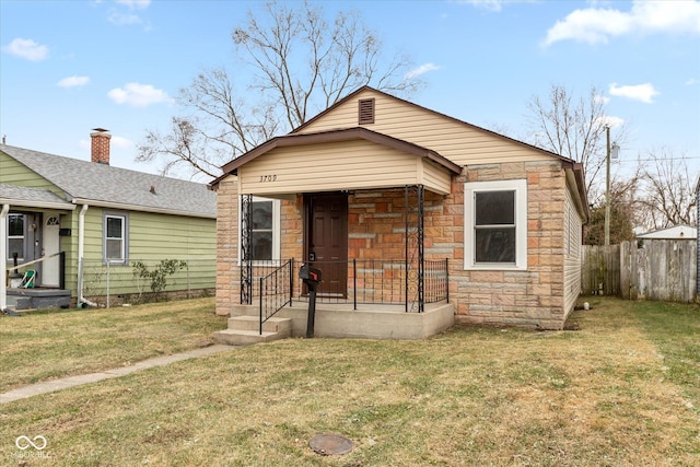 bungalow-style house with a front yard