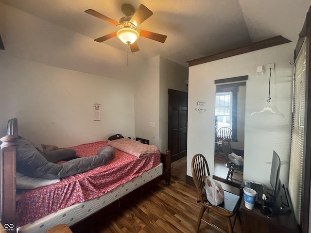 bedroom with ceiling fan and dark hardwood / wood-style flooring