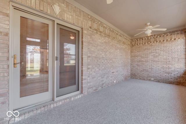 entrance to property with ceiling fan