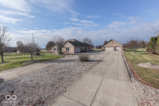 view of street featuring concrete driveway