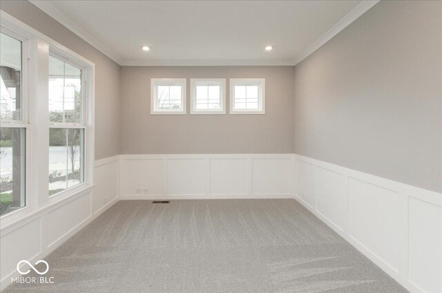 6973 Oakdale Ln, Avon, IN 46123 - empty room featuring a decorative wall and a wainscoted wall