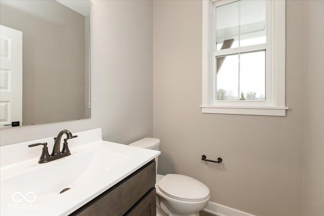 6973 Oakdale Ln, Avon, IN 46123 - half bath featuring vanity, baseboards, and toilet