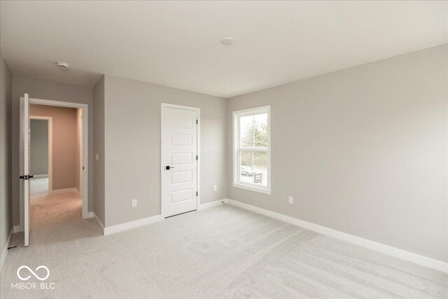 6973 Oakdale Ln, Avon, IN 46123 - unfurnished bedroom featuring light colored carpet and baseboards