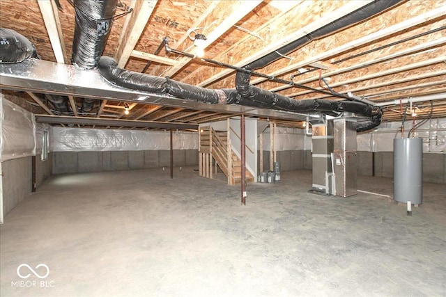 6973 Oakdale Ln, Avon, IN 46123 - unfinished below grade area featuring water heater, stairway, and heating unit
