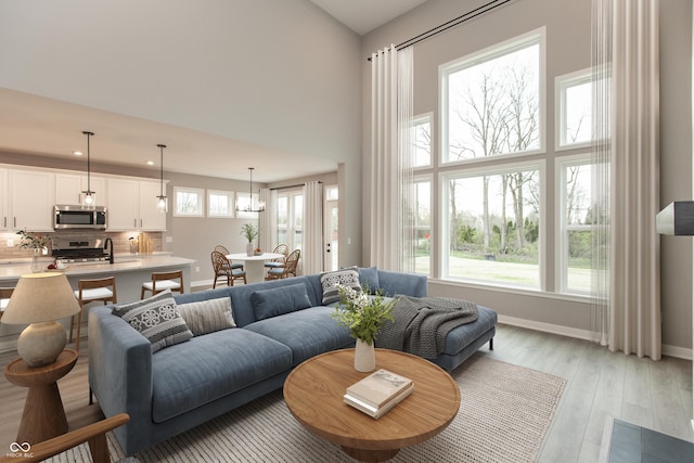6973 Oakdale Ln, Avon, IN 46123 - living area featuring baseboards and light wood-style flooring