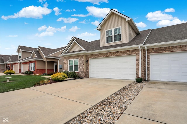 view of front facade featuring a front yard and a garage