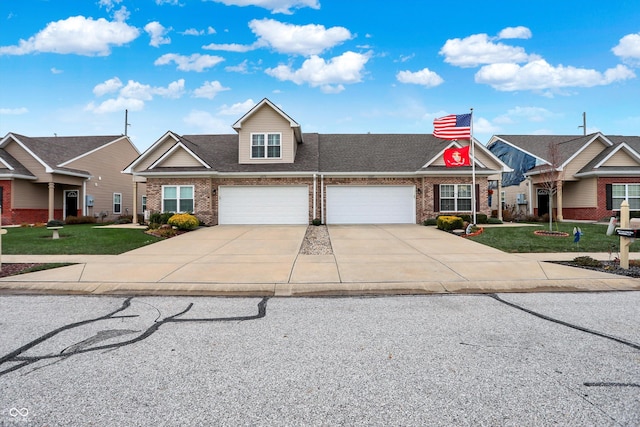 view of front facade featuring a front yard and a garage