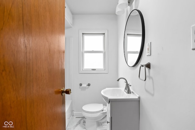 bathroom featuring vanity and toilet