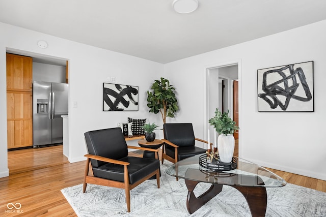 sitting room with light hardwood / wood-style flooring